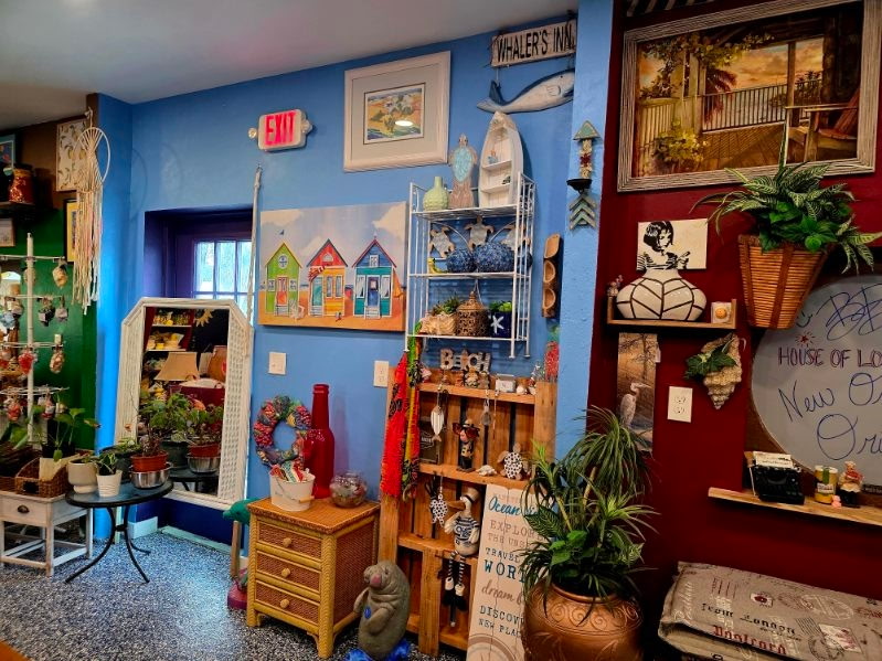 A coastal-themed corner with beach hut art and nautical decor