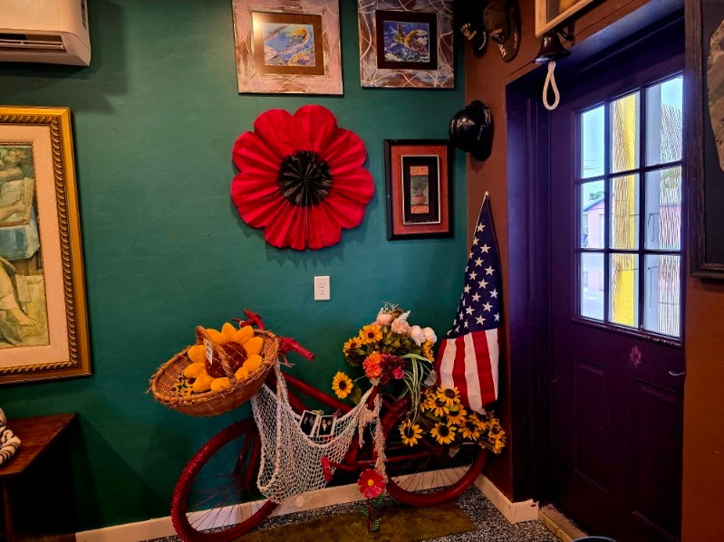 A repurposed bicycle transformed into a decorative flower display